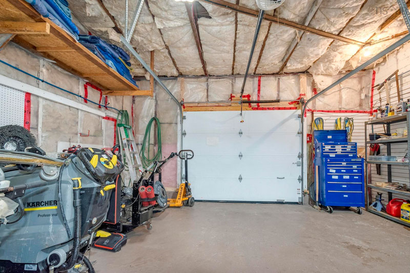 Overhead door provides direct access from driveway